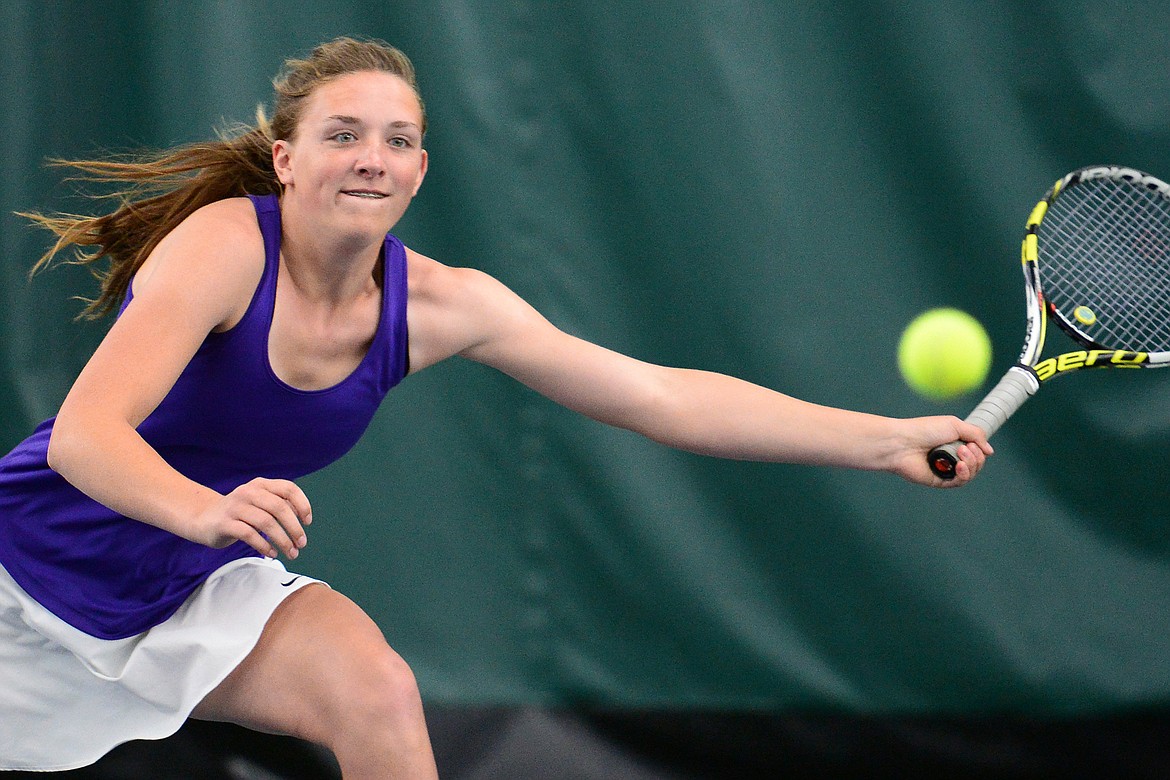 Polson's Qia Harlan hits a return in the Northwestern A Divisional girls' doubles championship with teammate Berkley Ellis against Whitefish's Olivia Potthoff and Aubrey Hanks at The Summit on Friday. (Casey Kreider/Daily Inter Lake)