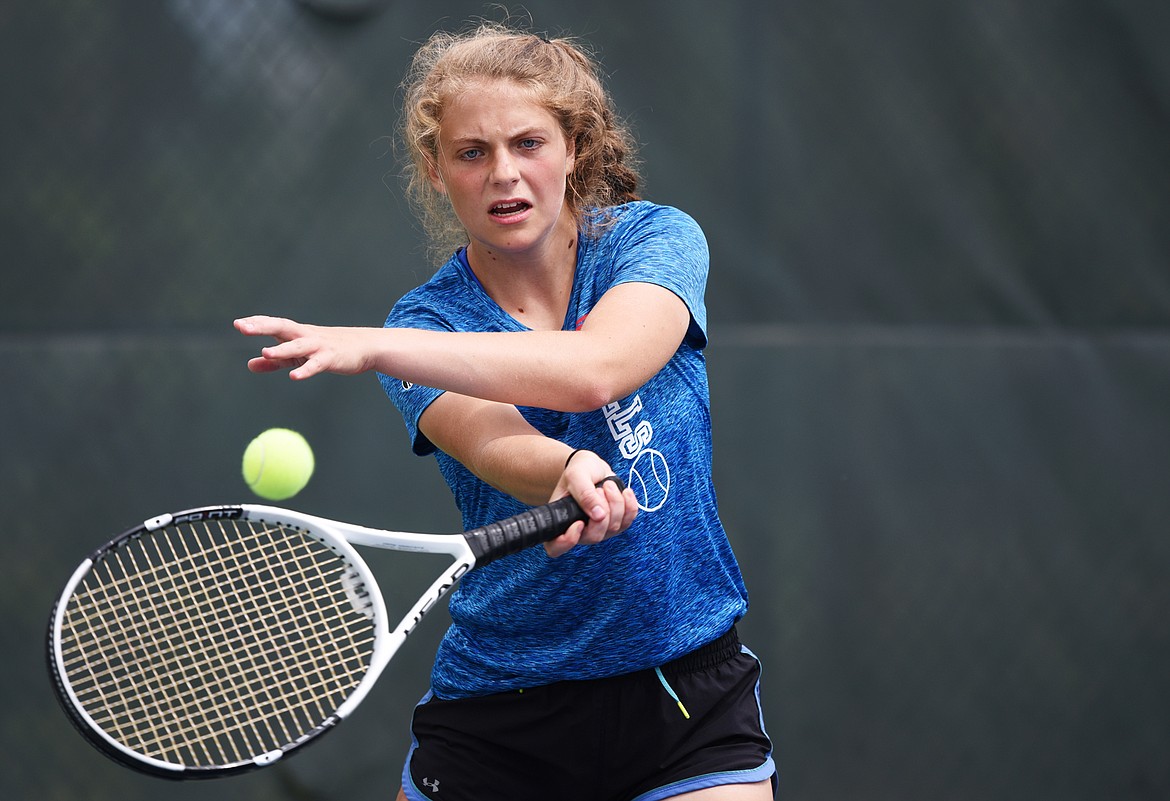 Columbia Falls' Hannah Schweikert hits a return against Polson's Sarah Kinzle in the Northwestern A Divisionals at Flathead Valley Community College on Thursday. (Casey Kreider/Daily Inter Lake)