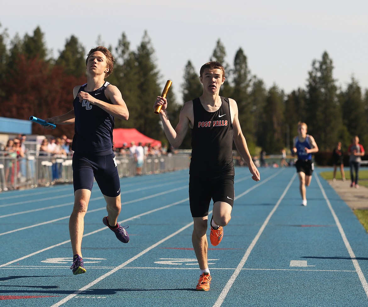 Post Falls&#146; JJ Magill crosses the finish line in first place a stride ahead of Lake City&#146;s Carter Gordon in the 4x800-meter relay at the 5A Region 1 track and field meet.