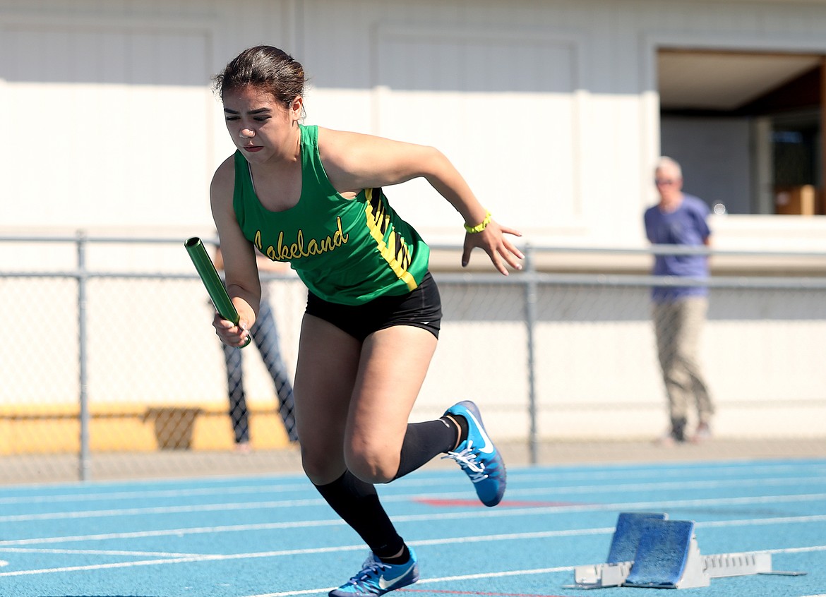 Lakeland High&#146;s Katelin Bronson shoots from the starting block at the beginning of the 4x200-meter relay at Thursday&#146;s 4A Region 1 track and field meet.