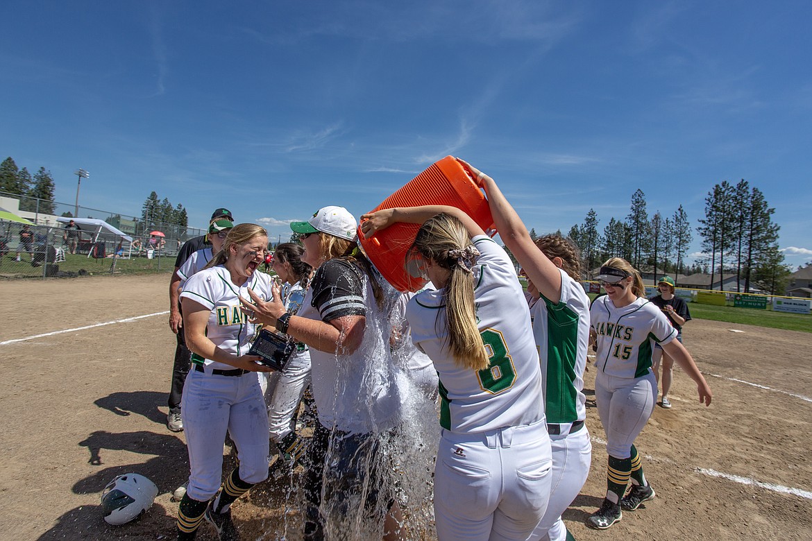 Photo by JASON DUCHOW PHOTOGRAPHY
Lakeland coach Colleen Bevacqua gets the ice water bucket treatment after the Hawks beat Sandpoint to win the 4A Region 1 softball title.