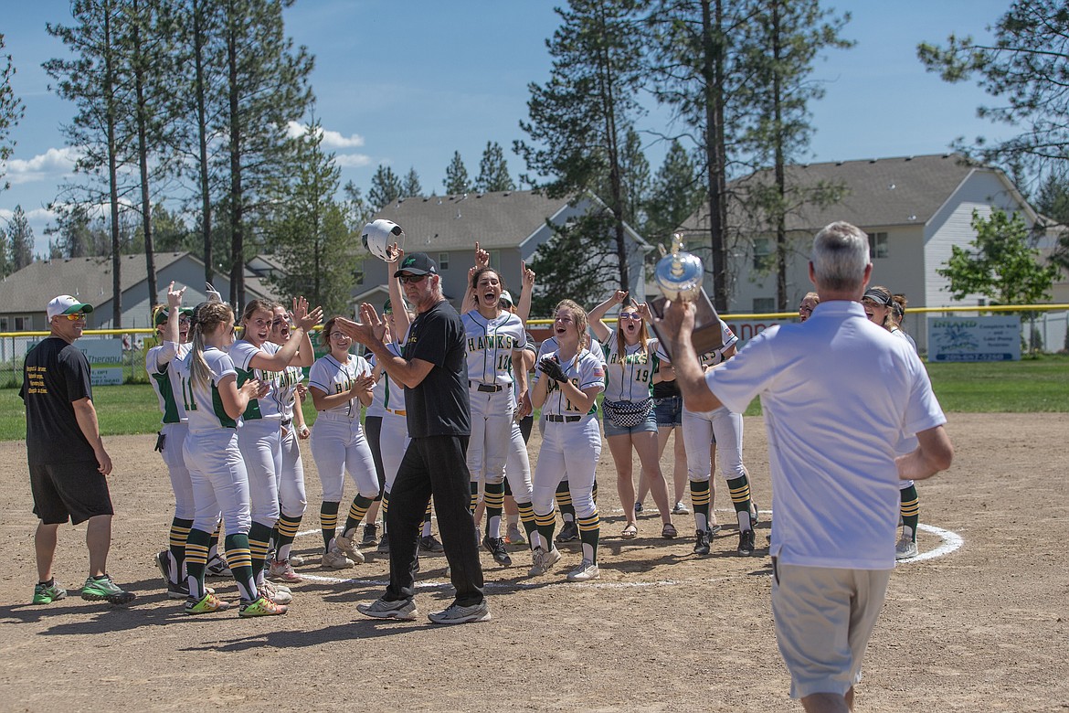 Photo by JASON DUCHOW PHOTOGRAPHY
Lakeland celebrates as the Hawks receive the trophy after winning the 4A Region 1 softball championship on Saturday.