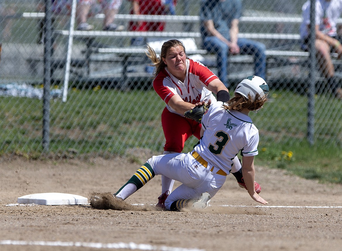 Photo by JASON DUCHOW PHOTOGRAPHY
Sandpoint third baseman Tanis Davis tags out Harley See of Lakeland in the first inning of the 4A Region 1 softball championship Saturday at Lakeland.