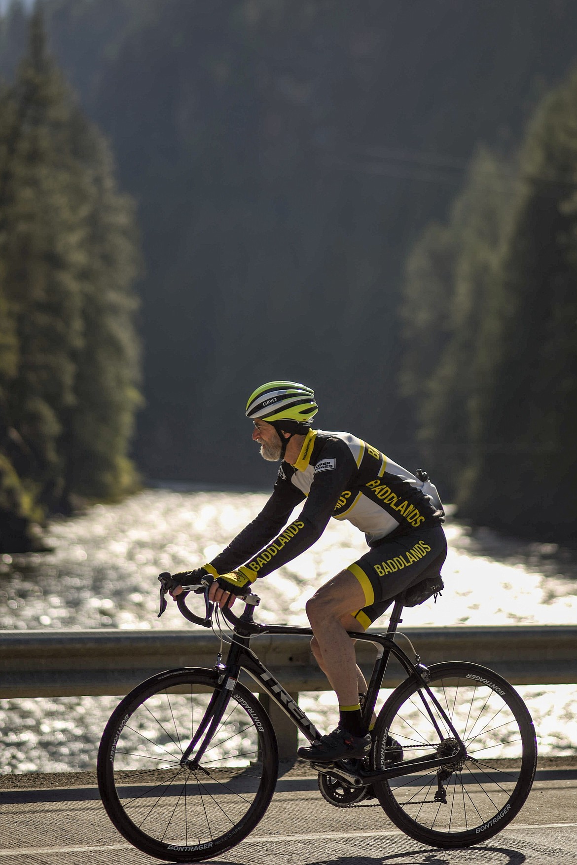 A bicyclist crosses over the Yaak River at the Scenic Tour of the Kootenai River fundraising event, Saturday. (Luke Hollister/The Western News)