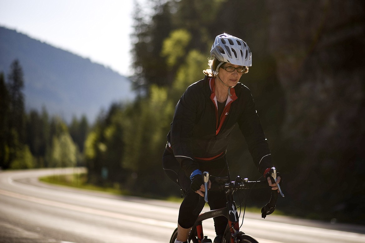 A bicyclist cruises down highway 2 at the 98 mile Scenic Tour of the Kootenai River fundraising ride, Saturday. (Luke Hollister/The Western News)