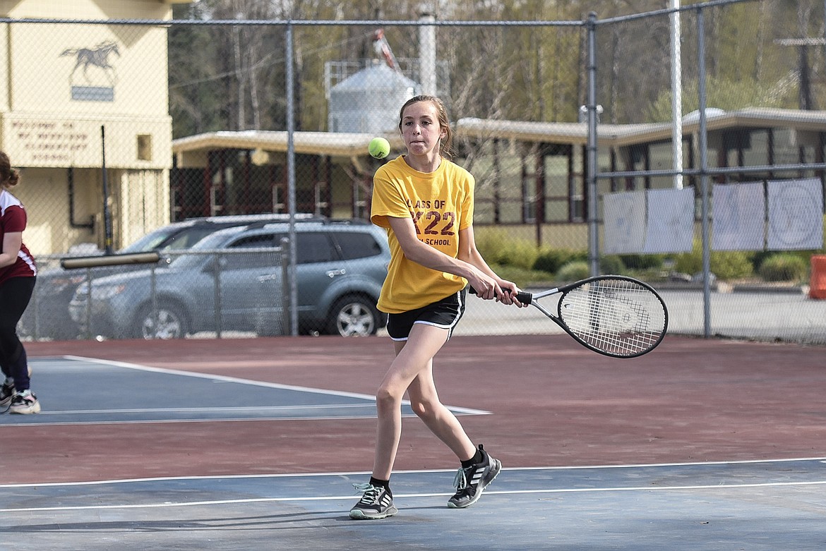 Troy freshman Kiersten McCully goes for a return during a singles match, May 3 against Superior. (Ben Kibbey/The Western News)