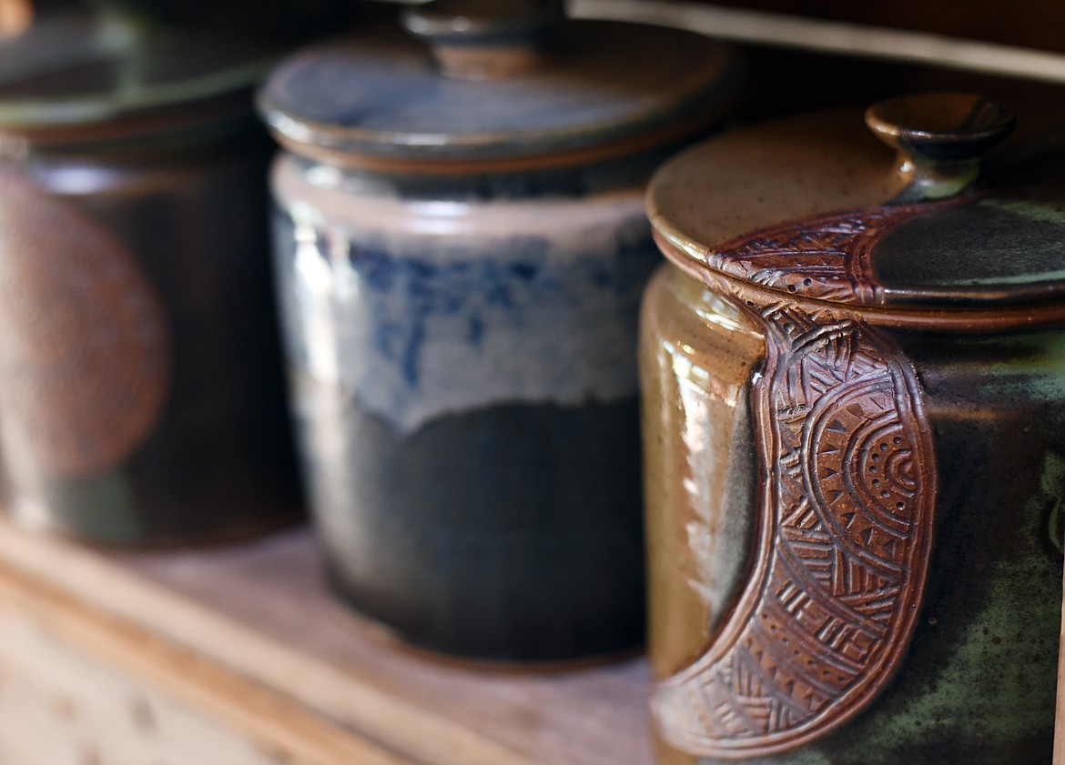 A collection of carved, glazed and fired jars for sale at Glacier Round House Pottery.(Brenda Ahearn/Daily Inter Lake)