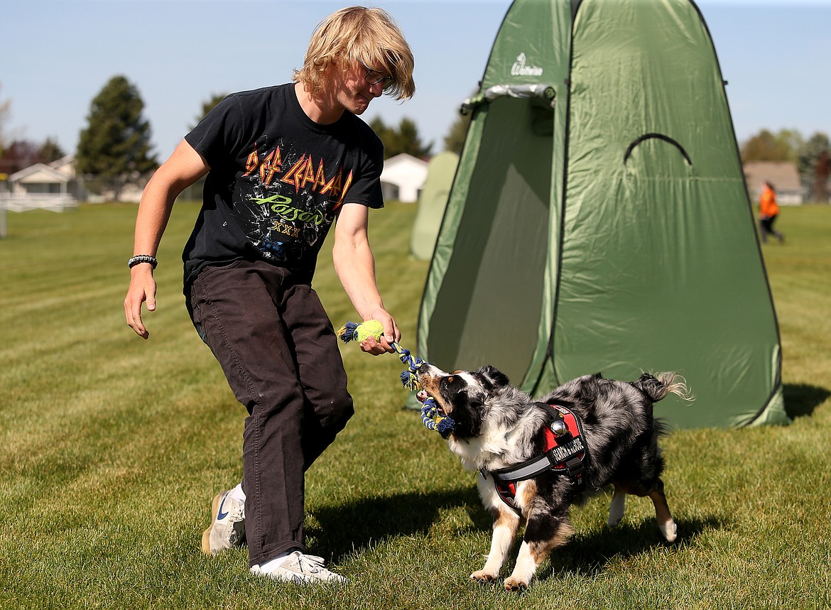 Ayala, a Kootenai County Search and Rescue dog, finds junior Jake Hines inside a tent and plays a reward game of tug of war during a survival science class Friday at Lake City High School. 

LOREN BENOIT/Press