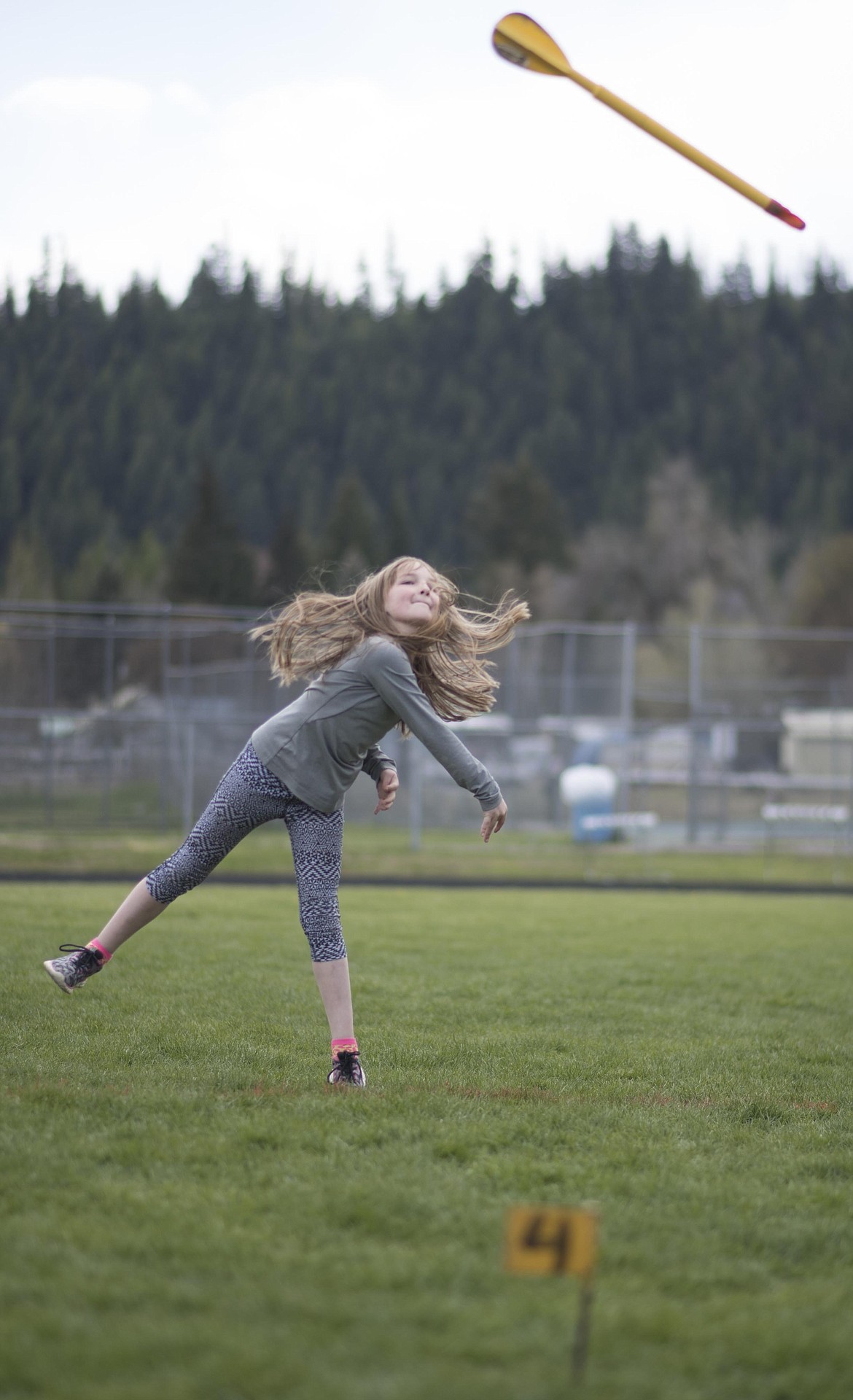 Tessa Purdy tests her throwing arm on the track during the 4th and 5th grade Mini Meet, Thursday, May 2 at the Libby High School. (Luke Hollister/The Western News)