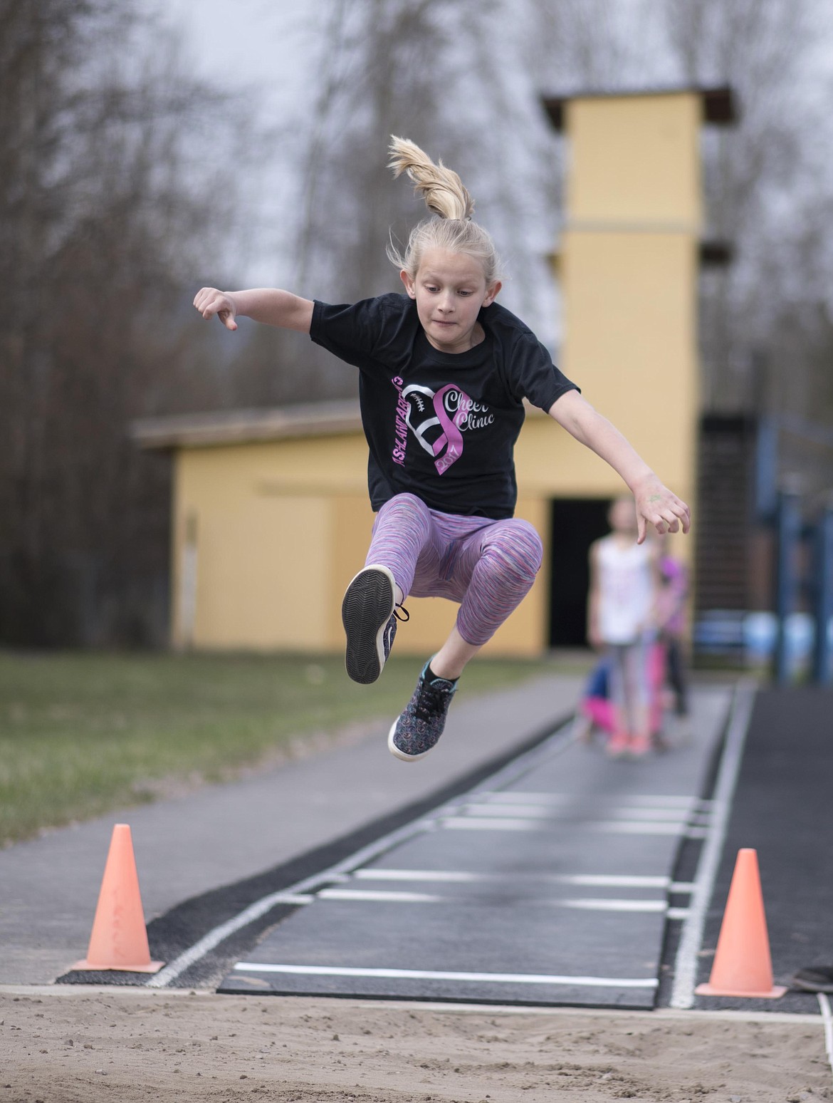 Quinn Morris, 4th grader, long jumps during the 4th and 5th grade mini meet, Thursday, May 2 at the Libby High School. (Luke Hollister/The Western News)