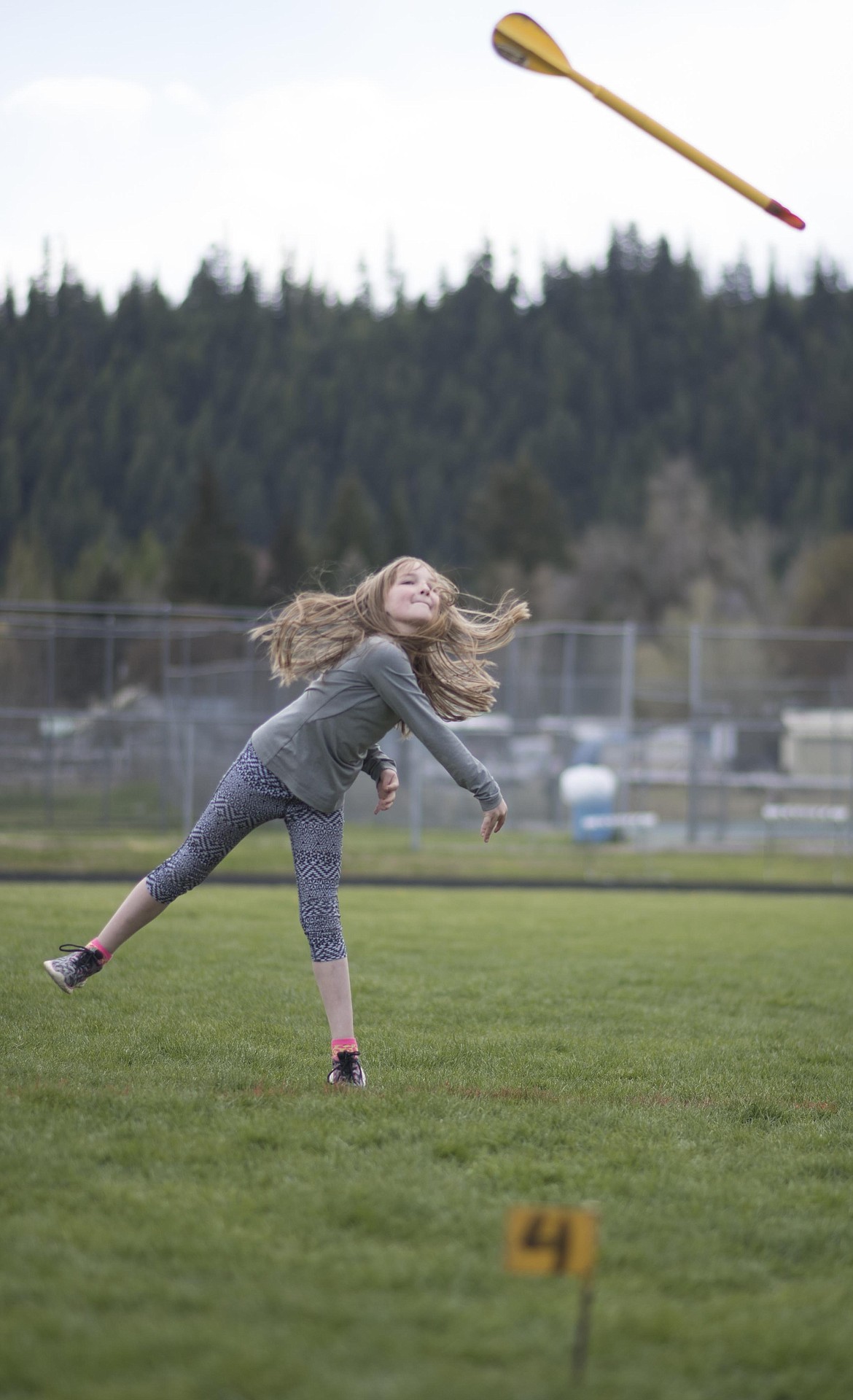 Tessa Purdy tests her throwing arm on the track during the 4th and 5th grade mini meet, Thursday, May 2 at the Libby High School. (Luke Hollister/The Western News)