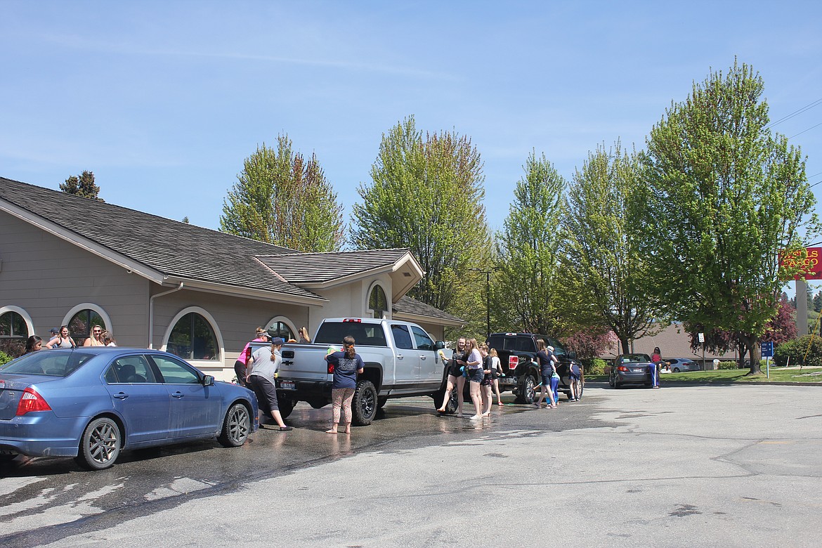 On May 11, the Babe Ruth Baseball/Softball teams gathered in the parking lot of Columbia Bank for a Car Wash fundraiser. With cars lined up to support the kids on a hot day, it was an opportunity for residents and visitors to support the local kids, get a detailed car wash, and help the teams have fun staying cool.

Photo by TANNA YEOUMANS