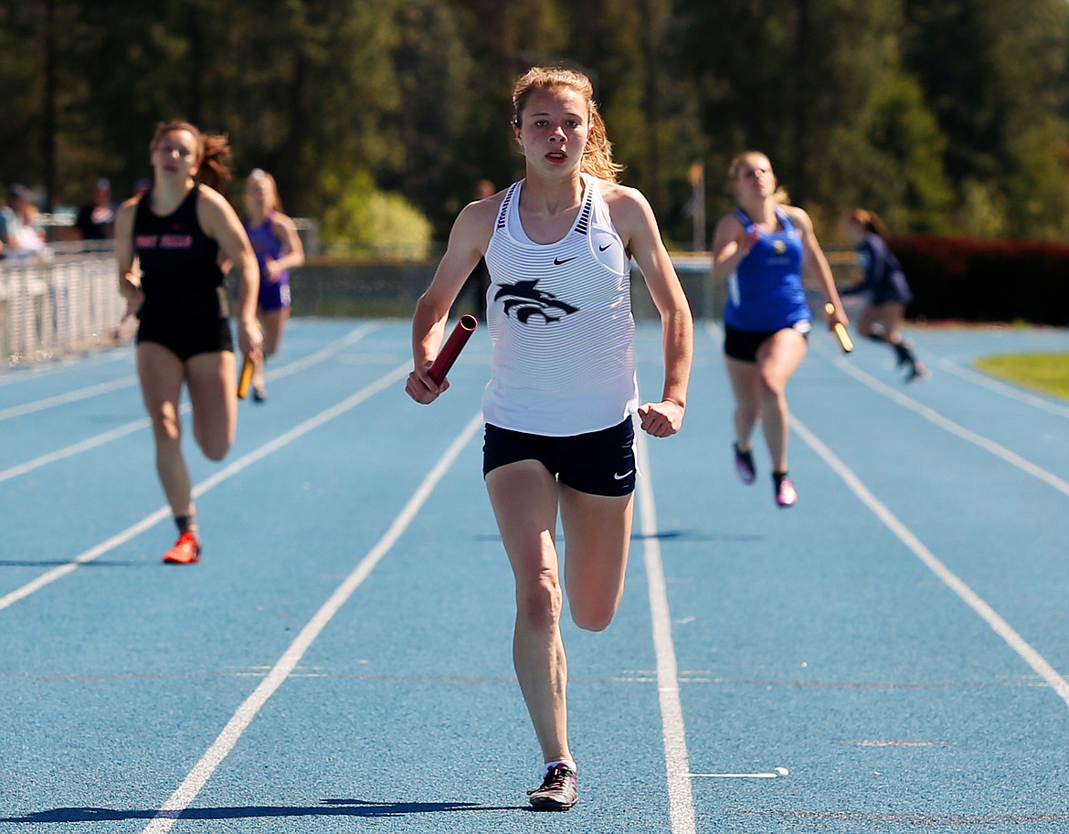 LOREN BENOIT/Press
Lake City&#146;s 4x200-meter relay anchor Angelyca Chapman crosses the finish line in first place at Thursday&#146;s 5A Region 1 track meet at Coeur d&#146;Alene High School.