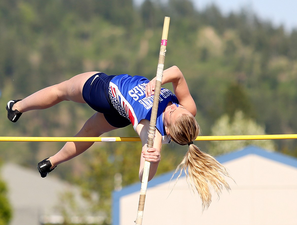 Coeur d'Alene's Alex Bennett successfully clears the bar in the pole vault at Thursday's 5A/4A Region 1 track meet at Coeur d'Alene High School. (LOREN BENOIT/Press)