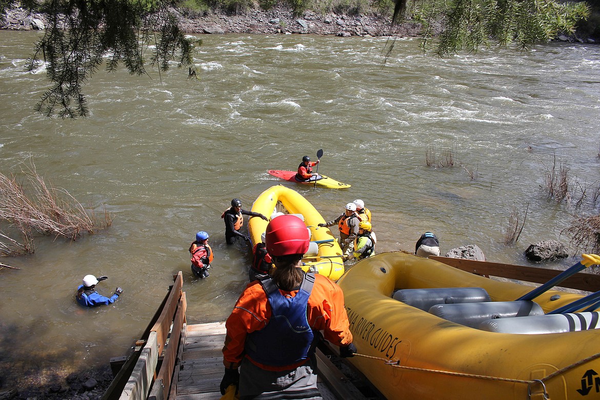 WRI INSTRUCTORS lead students down the boat ramp to begin hands-on Swiftwater Rescue training.