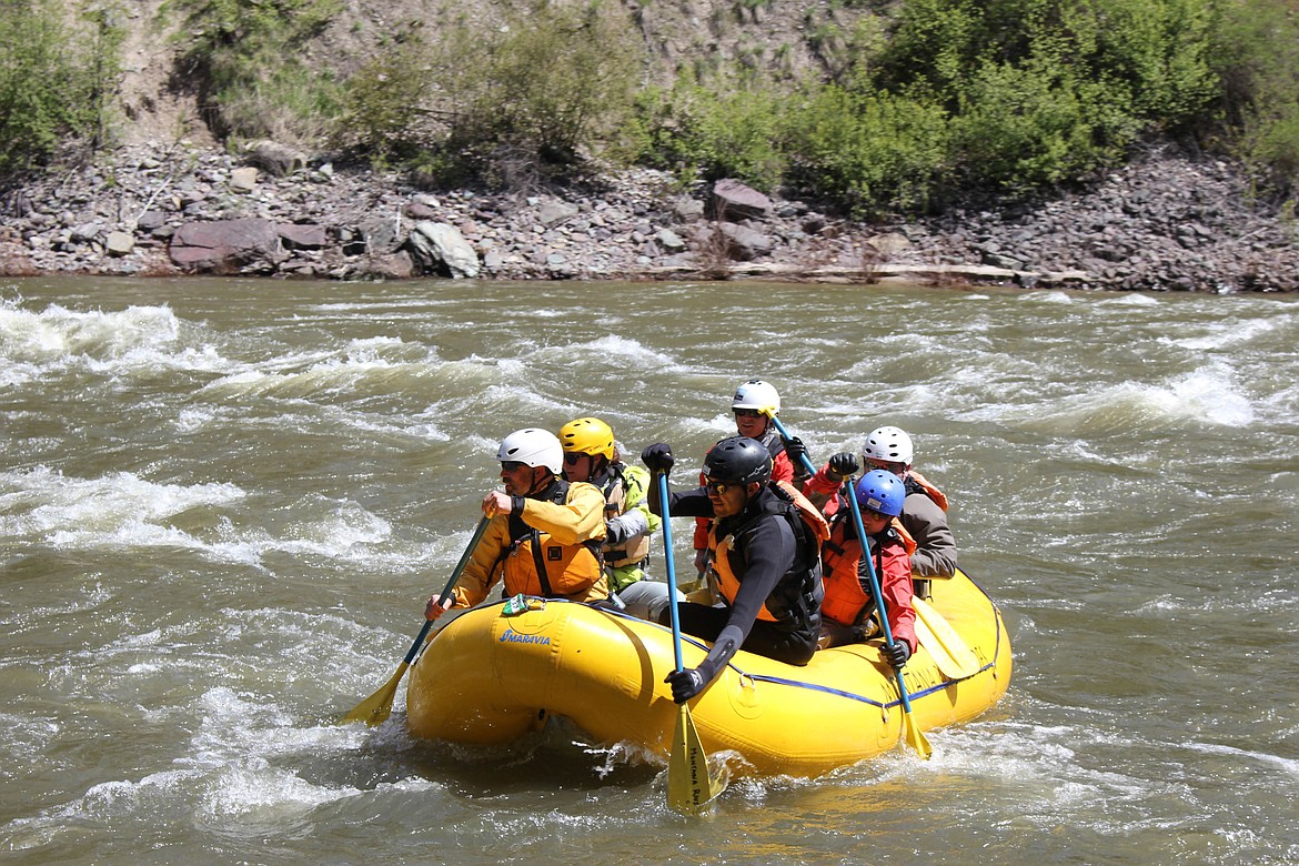 SWIFTWATER RESCUE students paddle down the Alberton Gorge.