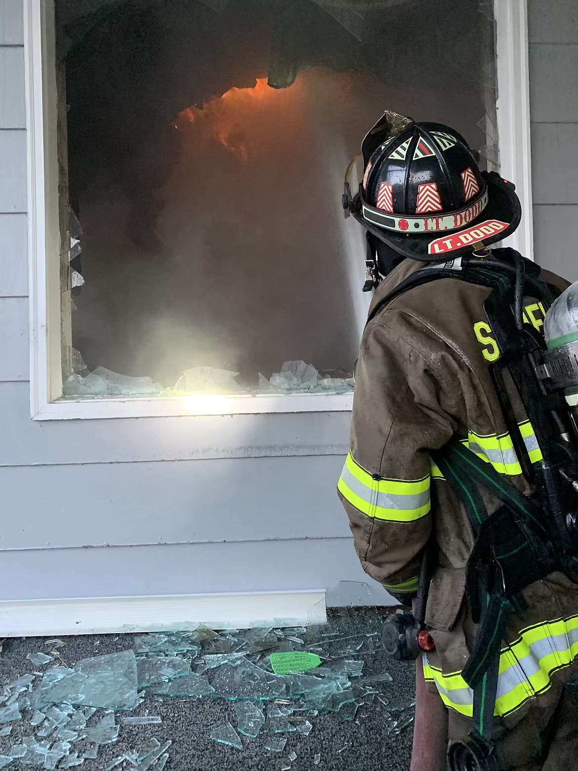 AN EMERGENCY responder works to extinguish the flames at the Hilltop Motel in Superior on Saturday, May 11. (Courtesy photo)