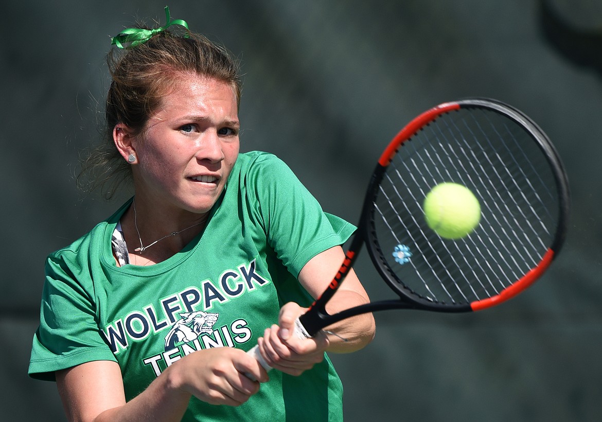 Glacier's Maria Frampton hits a backhand return against C.M. Russell's Gail Parambi in the championship match at Northern AA Divisionals at Flathead Valley Community College on Friday. (Casey Kreider/Daily Inter Lake)