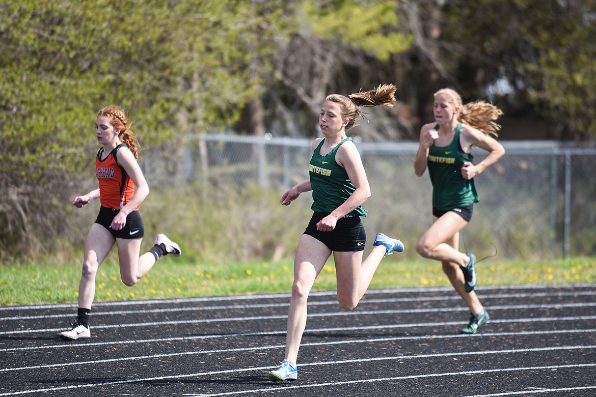 Mikenna Ells turns the corner in the 400 meter dash during a home dual against Flathead last week. (Daniel McKay/Whitefish Pilot)