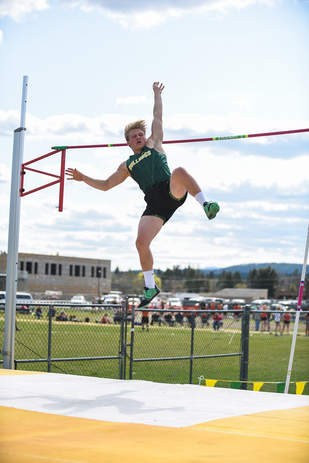 Dillon Muth clears the bar in pole vault during a home dual against Flathead last week. (Daniel McKay/Whtiefish Pilot)