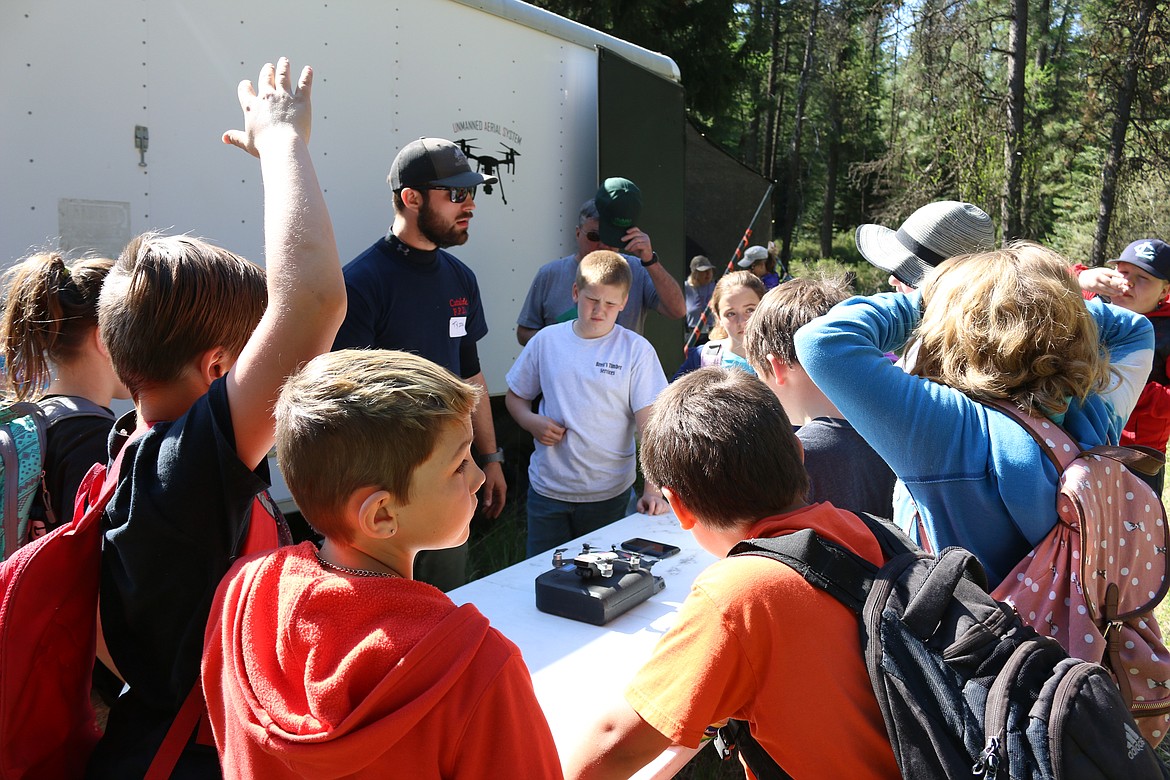 (Photo by MARY MALONE)
Area youngsters check out the drone station in the non-competitive novice division of the Idaho State Forestry Contest on Thursday at Delay Farms in Careywood.