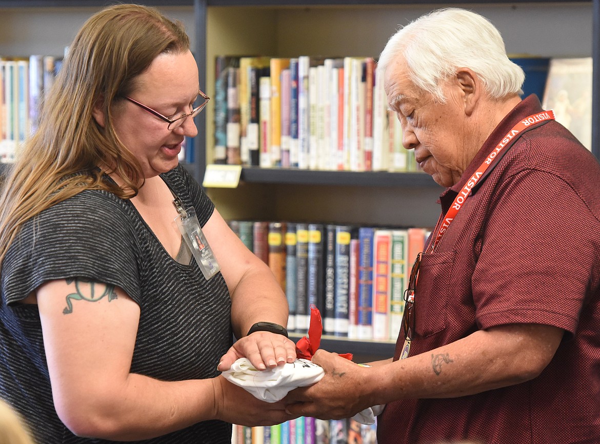 AMY WILLIAMS presents a special gift to Confederated Salish and Kootenai Tribes elder Tony Incashola, who is the CSKT liasion for the SMART Schools recycling program at PMS.