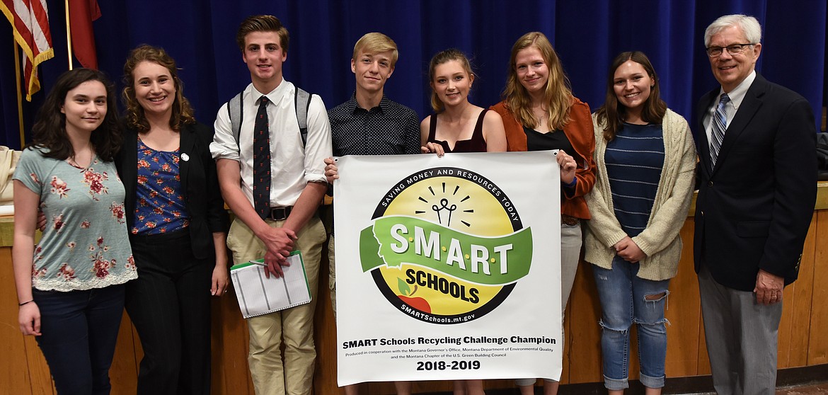 POLSON HIGH School received a SMART Schools Recycling Challenge Champion banner and a $1,000 check for the PHS recycling program from Lt. Gov. Mike Cooney during a Monday assembly. Pictured, from left are Savannah Houle, Montana SMART Schools coordinator Claudia Hewston, Makauly Morrison, Taylor Bloomquist, Bea Frissell, Lauren Vergeront and Cooney. (Joe Sova photos/Lake County Leader)