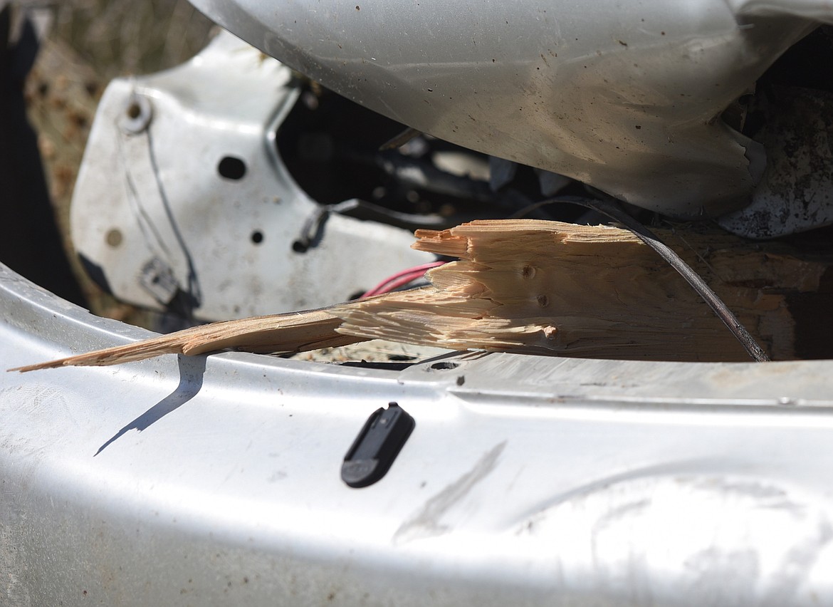 FRAGMENTS from a rail fence went through the front right wheel well and into the cabin of the vehicle, injuring the female passenger. Other fence pieces entered the engine compartment and the windshield.