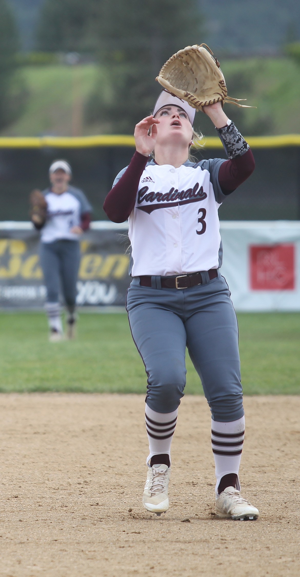 North Idaho College second baseman Ashlyn Winn camps under a popup against Edmonds.