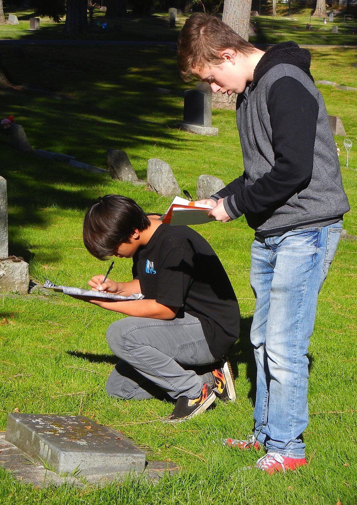 Courtesy photo 
Issac Preciado, left, and Jon Overland were among the Boy Scouts who assisted Benjamin Givens with his Eagle Scout project updating the database of veterans&#146; graves in Forest and Riverview cemeteries in Coeur d&#146;Alene.