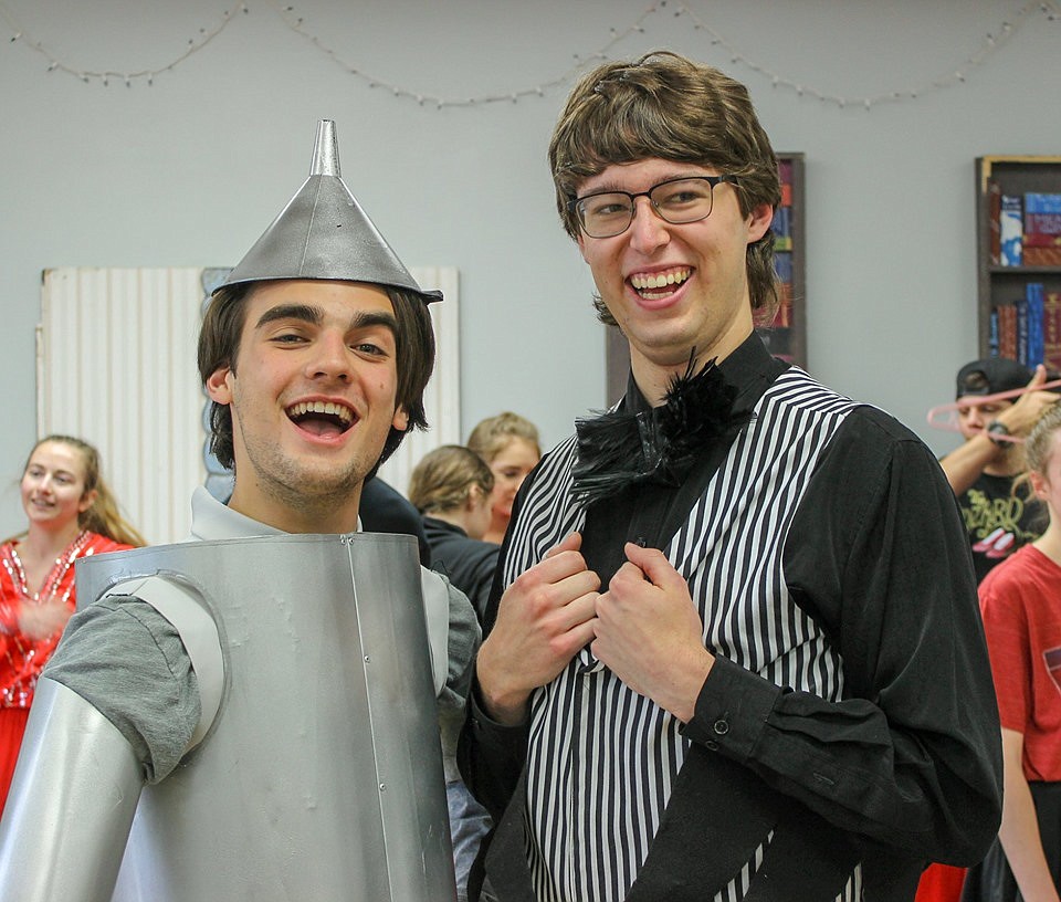 Jared Kraft as the Tin Man, tries on his costume at a dress rehearsal. The costume was built by Gabe Gunning, pictured here with Kraft. (courtesy photos)