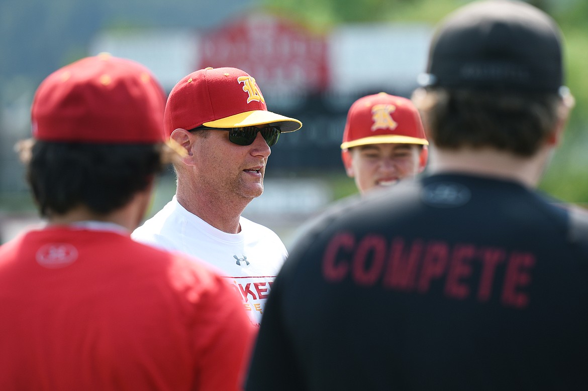 Kalispell Lakers AA head coach Ryan Malmin speaks to the team at the start of practice at Griffin Field on Wednesday. (Casey Kreider/Daily Inter Lake)