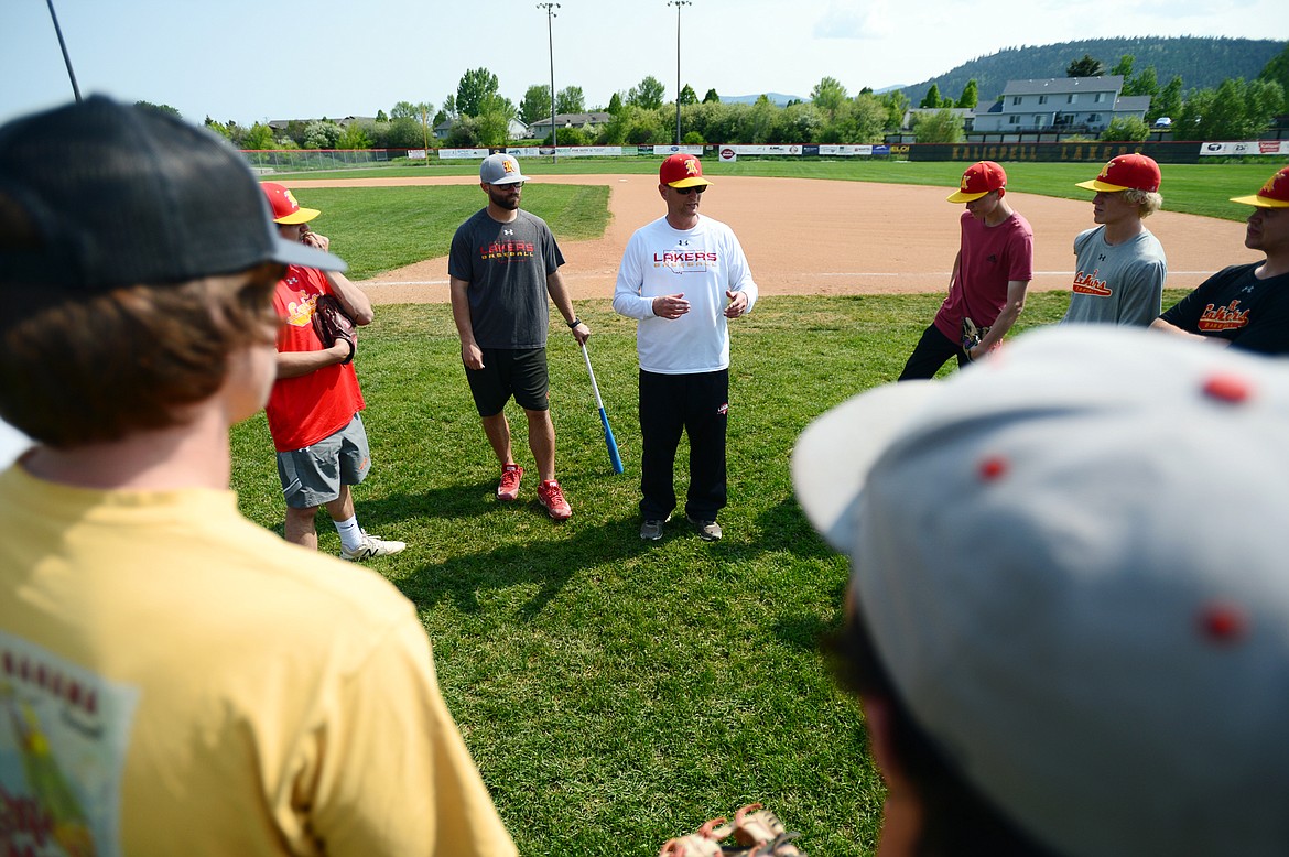 Kalispell Lakers AA head coach Ryan Malmin speaks to the team at the start of practice at Griffin Field on Wednesday. (Casey Kreider/Daily Inter Lake)