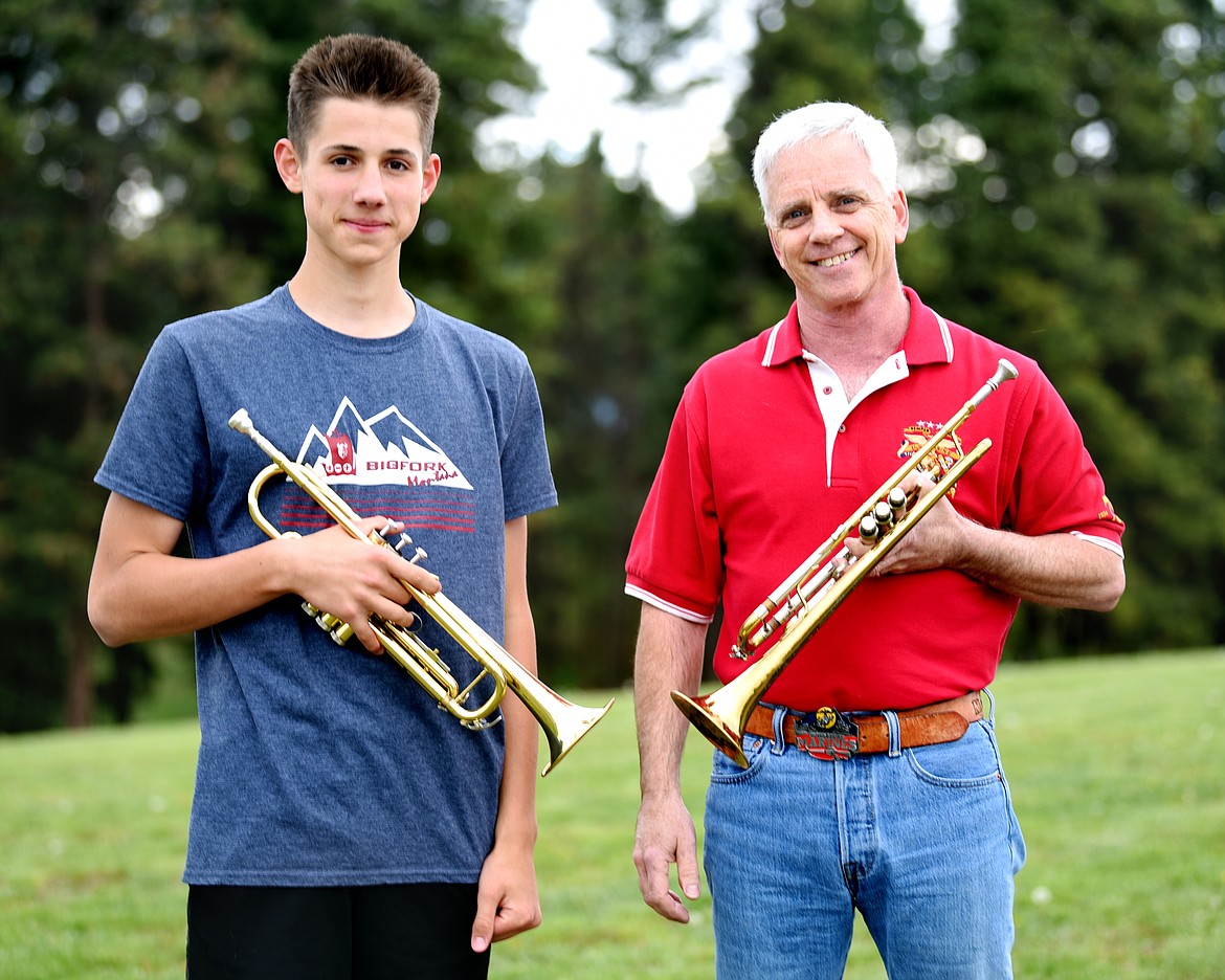 Dale Relyea, 13, of Bigfork, with United States Marine veteran Timothy &#147;Merk&#148; Merklinger, 55, at Flathead Valley Community College on May 20. Relyea began working with Merklinger five weeks ago to learn to play &#147;Taps&#148; so he could help with military funerals and other functions. (Brenda Ahearn/Daily Inter Lake)