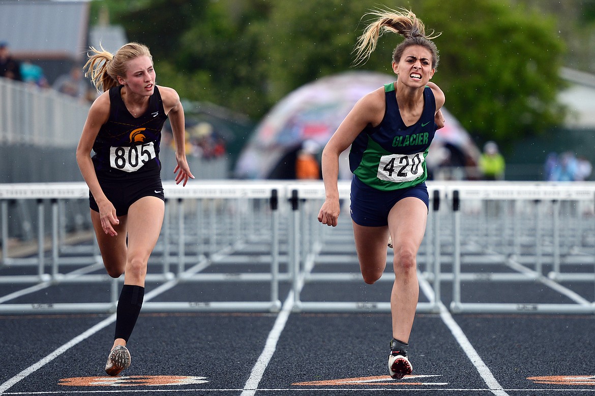 Glacier's Faith Brennan leans in at the finish of the girls 100 meter hurdles at the Class AA State track and field meet at Legends Stadium on Saturday. (Casey Kreider/Daily Inter Lake)