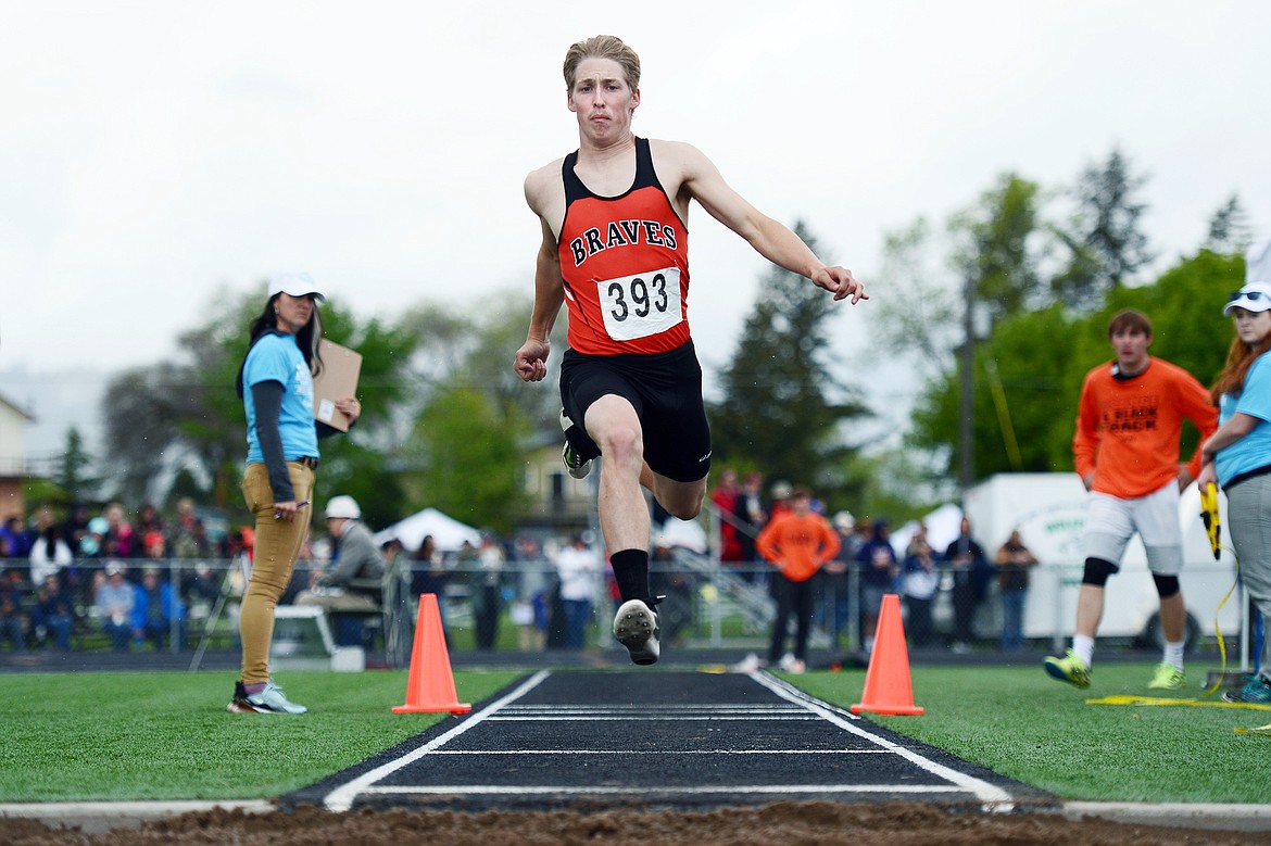 Flathead's Seth Moon competes in the triple jump at the Class AA State track and field meet at Legends Stadium on Saturday. (Casey Kreider/Daily Inter Lake)