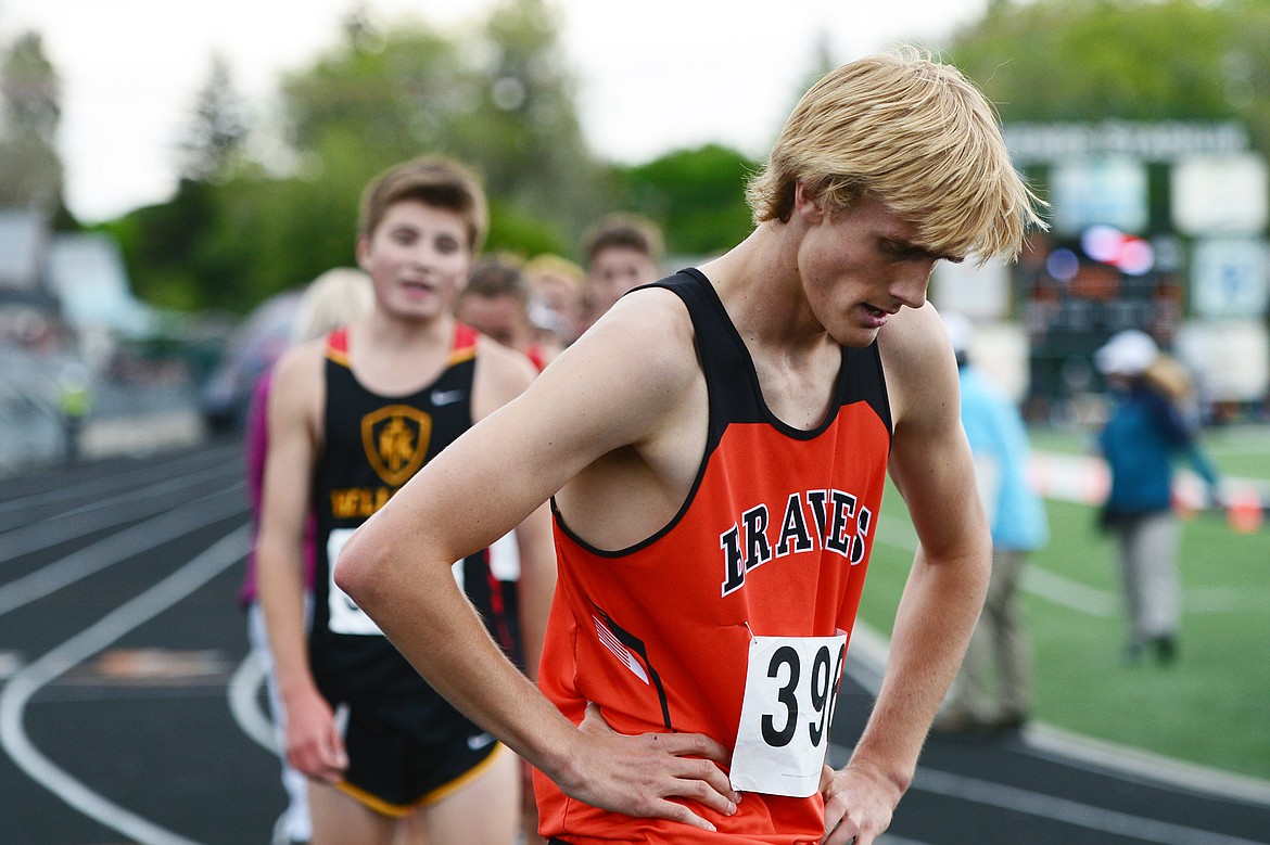Flathead's Ben Perrin catches his breath after winning the boys 3,200 meter run at the Class AA State track and field meet at Legends Stadium on Friday. (Casey Kreider/Daily Inter Lake)
