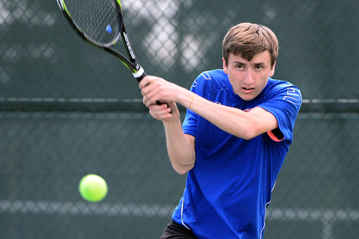 Columbia Falls' John Gilk hits a return in a boys' doubles consolation match with teammate Camryn Lingle in the Class A State Tennis Tournament at Flathead Valley Community College on Friday. (Casey Kreider/Daily Inter Lake)