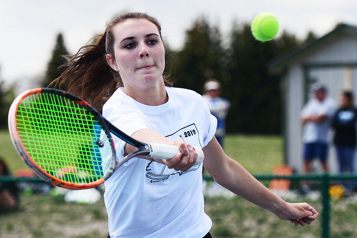 Whitefish's Olivia Potthoff hits a return in the girls' doubles final with teammate Aubrey Hanks against Polson's Qia Harlan and Berkley Ellis in the Class A State Tennis Tournament at Flathead Valley Community College on Friday. (Casey Kreider/Daily Inter Lake)