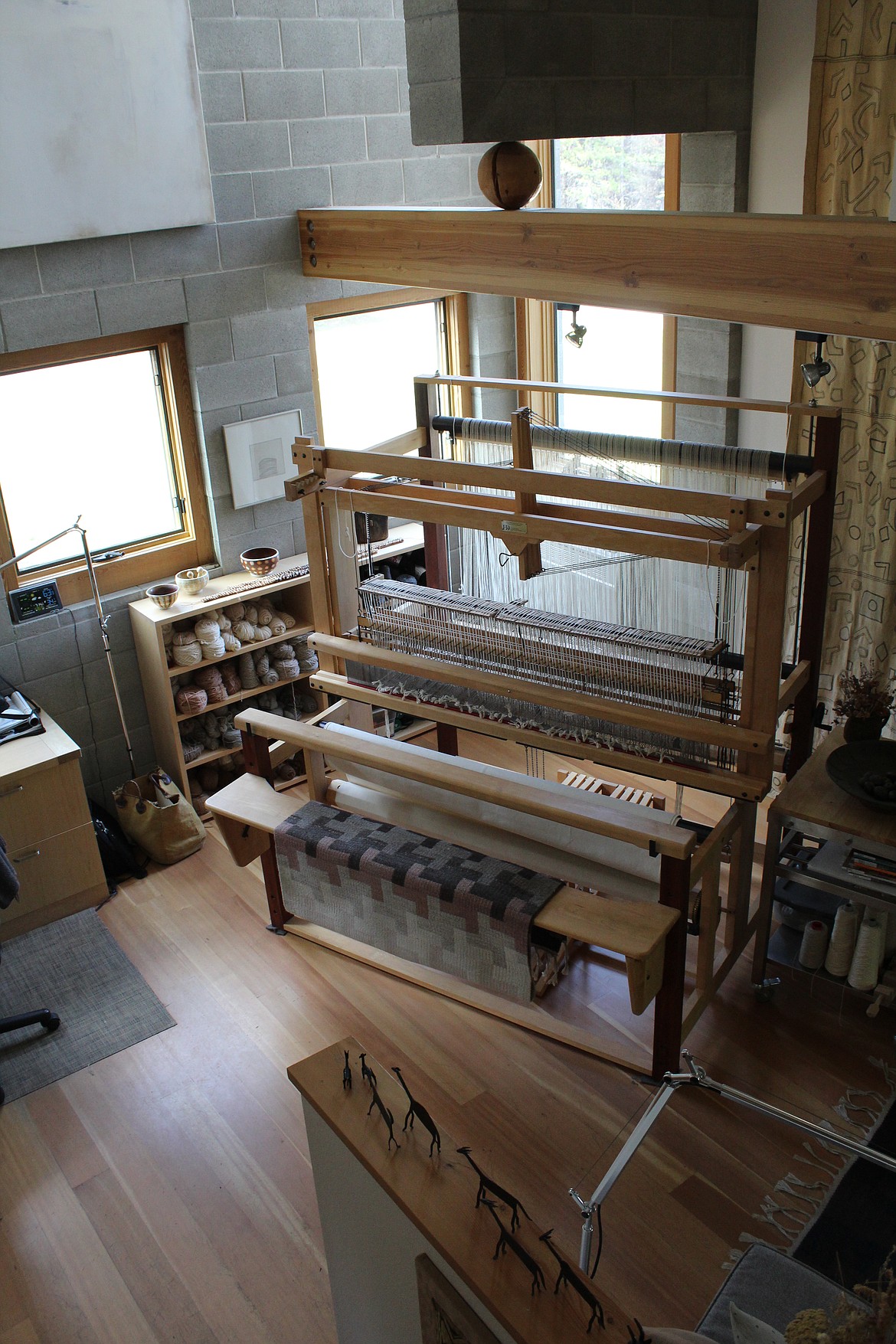 Shepherd weaves rugs on a loom that occupies a large 
room in her North 
Fork house.