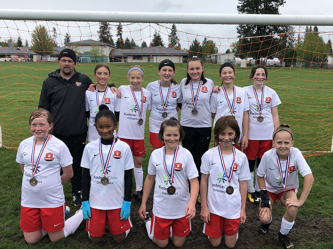 Courtesy photo
The Thorns 07 Girls-White played their final Puget Sound Premier League match against the Spokane Storm, winning 2-1. They also placed third in their age division in the Bill Eisenwinter Hot Shot Tournament on May 12. In the front row, from left, are: Hanna Coyne, Jamie Lawrence, Mallory Judd, Melina Biondo and Lily Bole. In the back are: coach Kirk Hartzell, Lily Smith, Emma Decker, Ali Van Ditto, Emma Singleton, Dani Todd and Zayda Voigt.