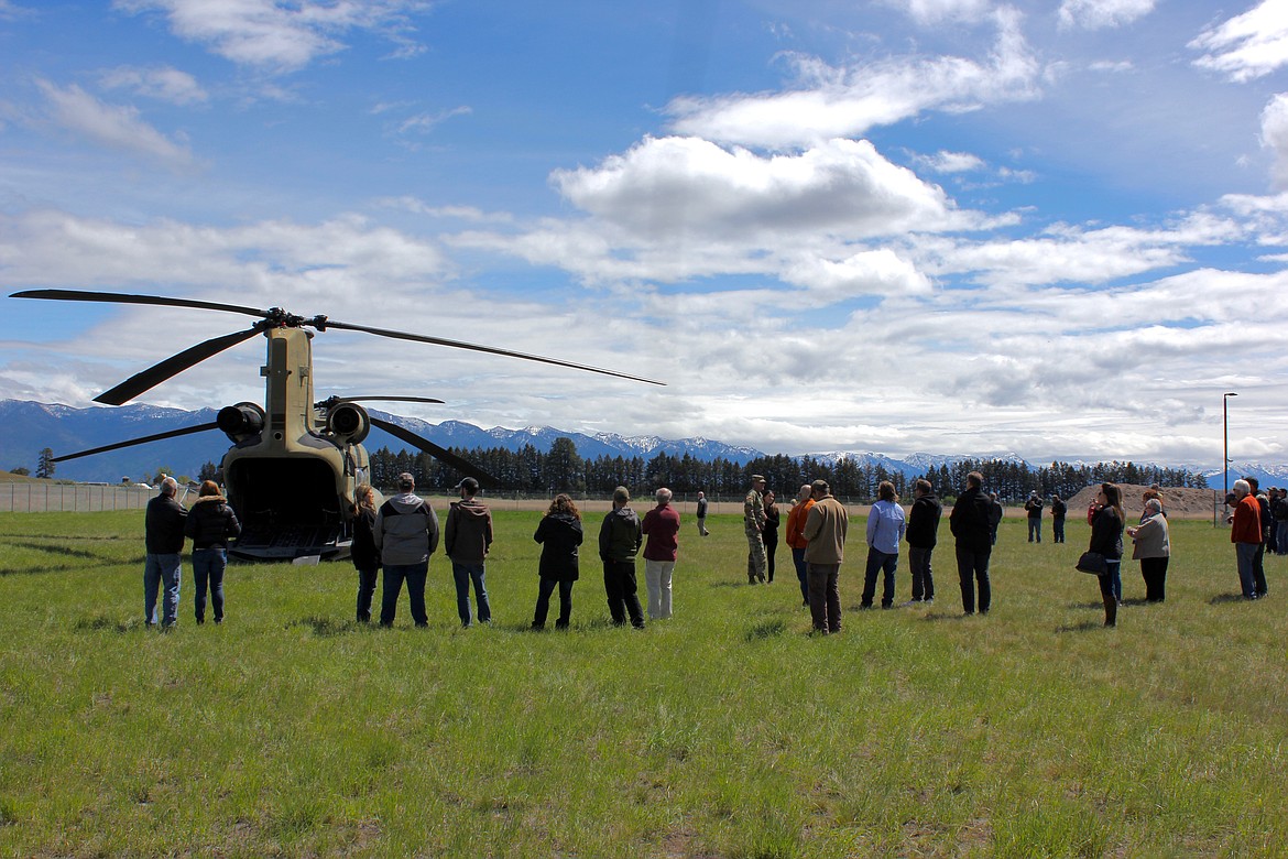 A group of Flathead County &quot;civilian employers&quot; prepare to board the Boeing CH-47 Chinook helicopter as part of ESGR's &quot;boss lift&quot; event. (Kianna Gardner/Daily Inter Lake)