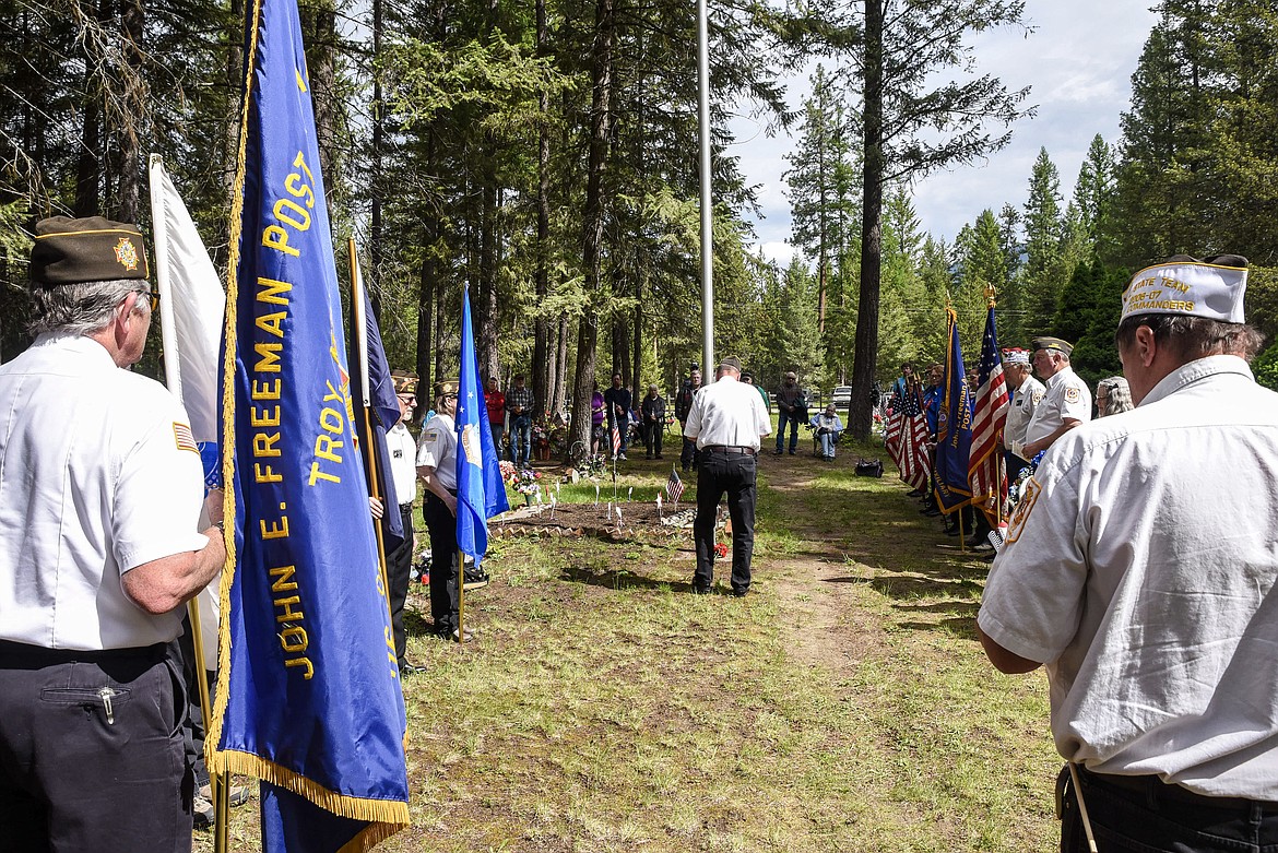 Troy VFW Post 1548 members and auxiliary stand in formation during the Memorial Day service at Milner Lake Cemetery. (Ben Kibbey/The Western News)
