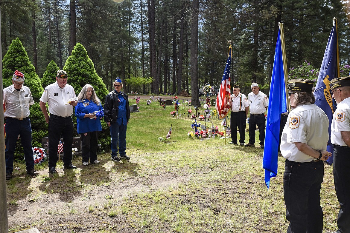 Mike Casey (second from left), acting chaplain for Troy VFW Post 1548, reads a prayer for fallen comrades during the Memorial Day service at Milnor Lake Cemetery. (Ben Kibbey/The Western News)