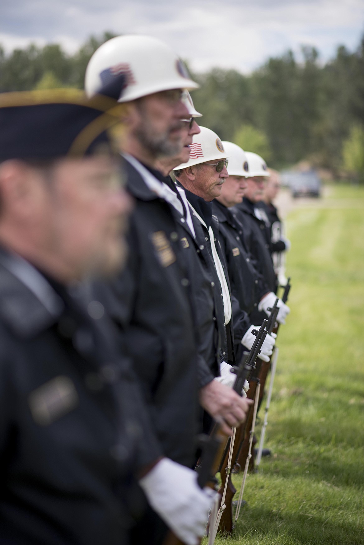 Libby American Legion members prepare to shoot rounds off in honor of veterans during a Memorial Day service, Monday at the Libby Cemetery. (Luke Hollister/The Western News)