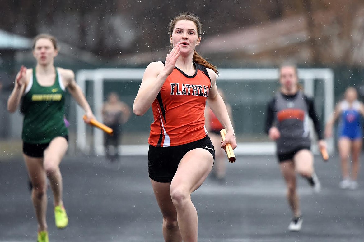 Flathead's Jessica Barnhart competes in the girls' 4 x 100 relay at the Flathead Mini Invite at Legends Stadium on Tuesday. (Casey Kreider/Daily Inter Lake)