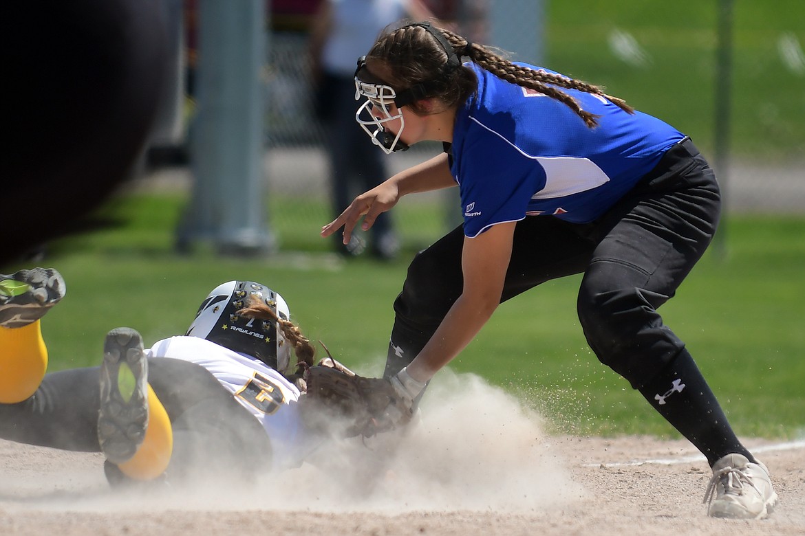 Alyssa Blankenship tries to tag out a Stevensville runner at third