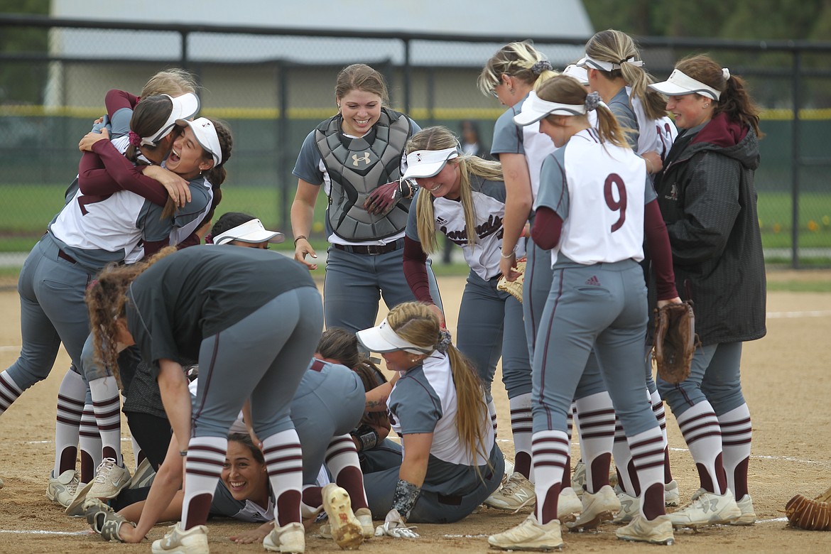 MARK NELKE/Press
North Idaho College players celebrate after beating Edmonds on Monday to win the Northwest Athletic Conference softball championship at the Dwight Merkel Sports Complex in Spokane.