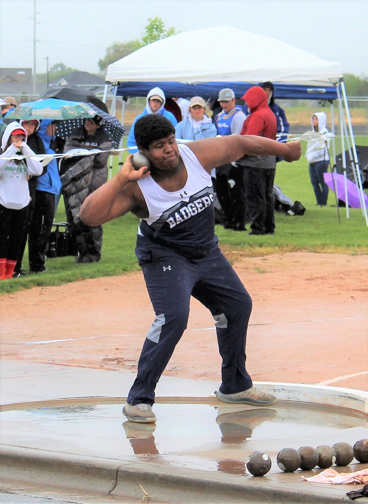 Photo by TERESA RAE
Quinn Tucker throwing shotput.