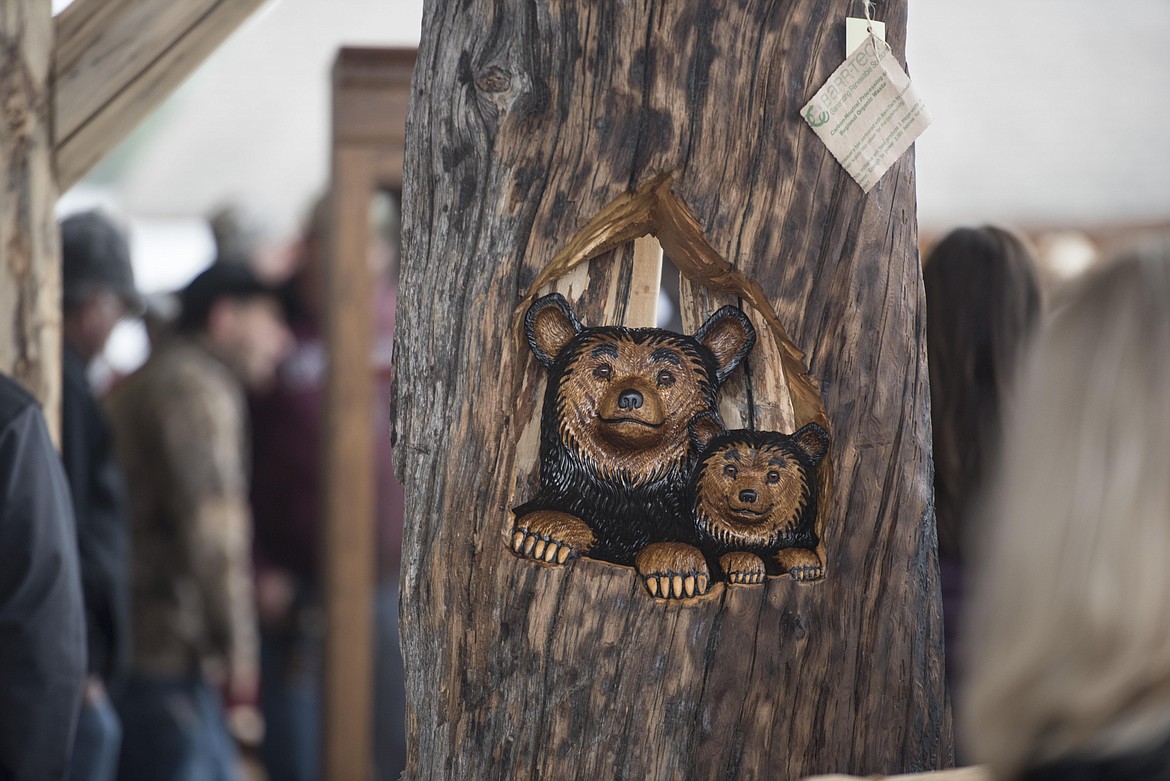 A handmade carving of bears for sale at the annual amish Eagle Valley Community Auction, May 18. (Luke Hollister/The Western News)